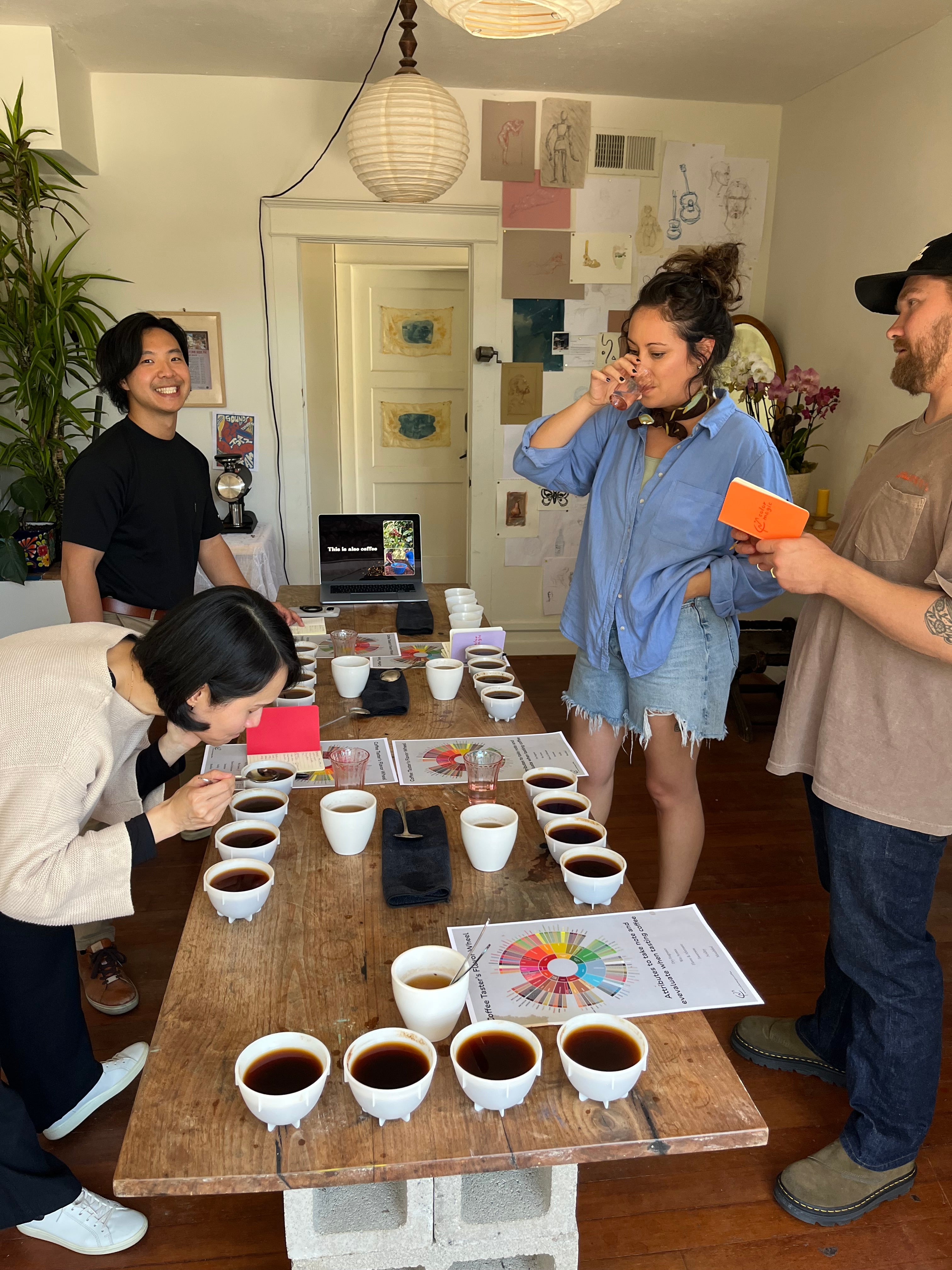 Cupping table set with tasting cups during a studio visit