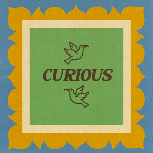 Color Magic Curious coffee subscription, a dove emblem and the word Curious on a green card with a gold scalloped border