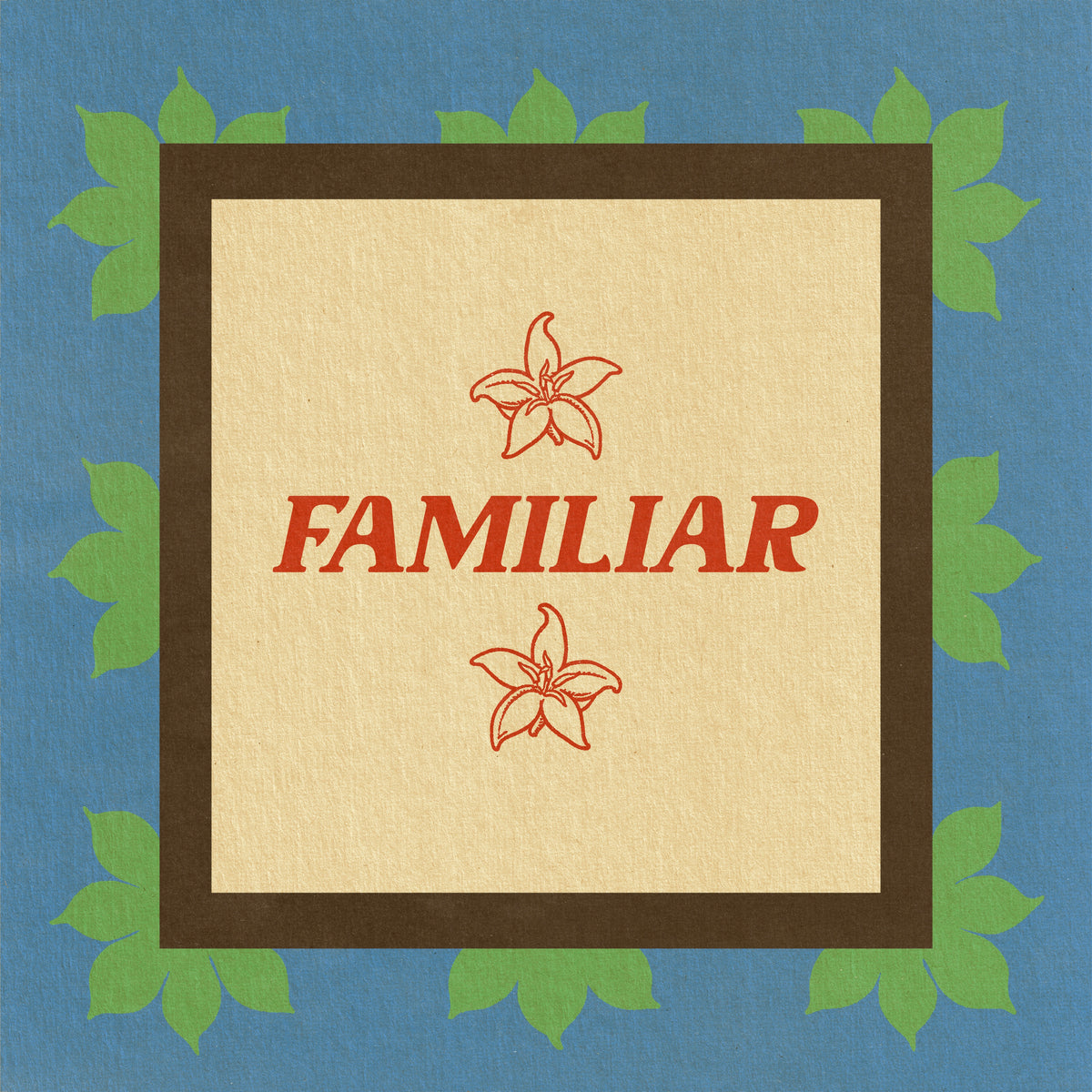 Color Magic Familiar coffee subscription, a red lily emblem and the word Familiar on a cream card with a green scalloped border