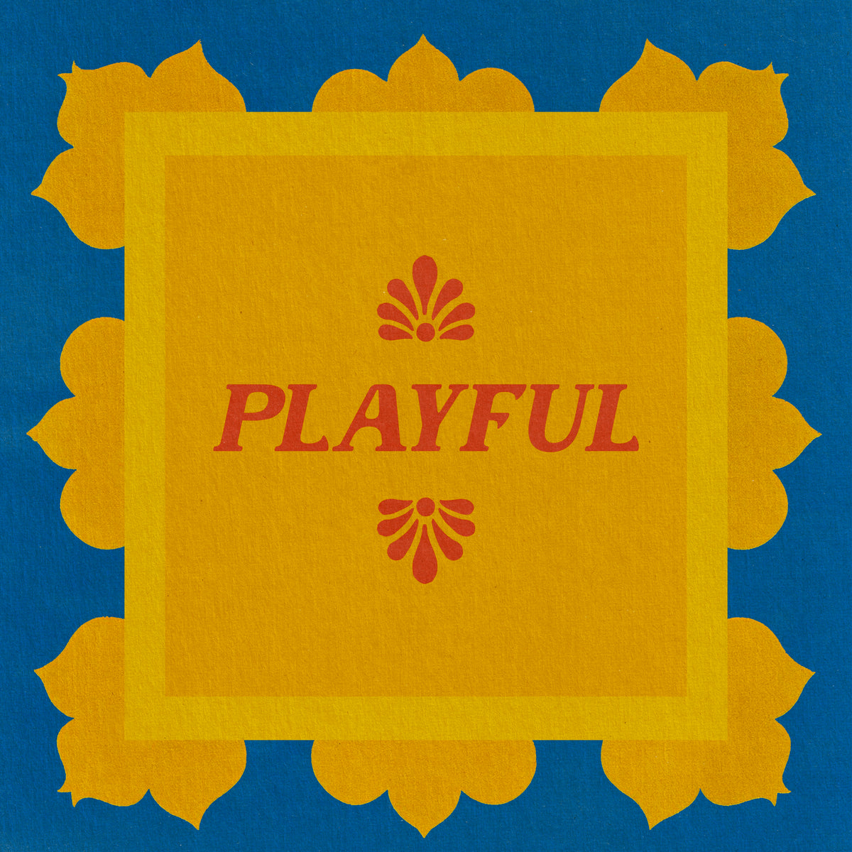 Color Magic Playful coffee subscription, a red flower emblem and the word Playful on a gold card with a blue scalloped border